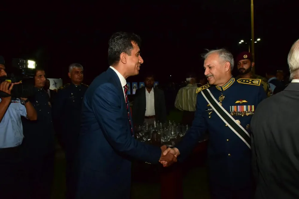 Dr. Irshad Ahmad Malik receiving recognition at a ceremony