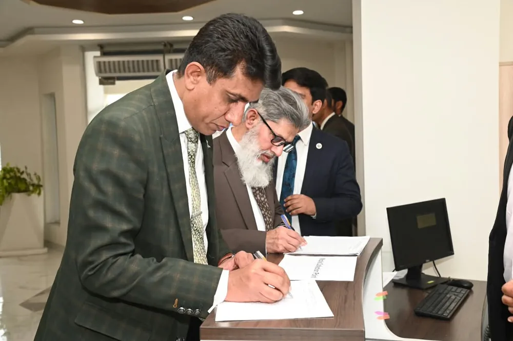 Dr. Irshad Ahmad Malik during a recognition ceremony