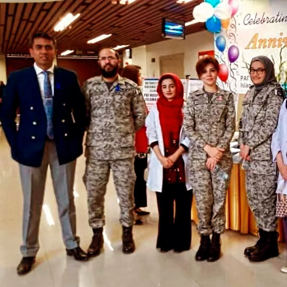 Dr. Irshad Ahmad Malik with colleagues at an event